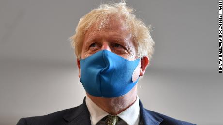 Britain&#39;s Prime Minister Boris Johnson, wearing a face mask or covering due to the Covid-19 pandemic, visits the headquarters of the London Ambulance Service NHS Trust  on July 13, 2020 in London, England. 