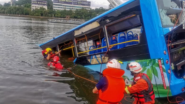 Rescuers work after a bus plunged into a lake in Anshun in China&#39;s southwestern Guizhou province on July 7.