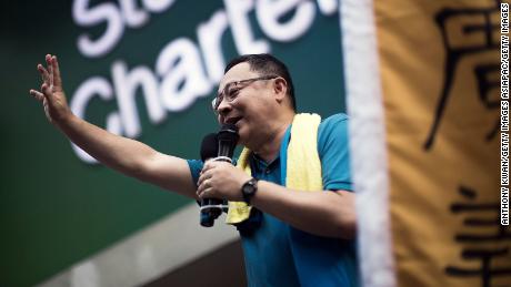 Hong Kong activist and protest leader Benny Tai waves to the crowd during a rally in July 2015.