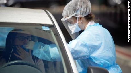 A nurse uses a swab on a woman in Toulouse. France on April 28th