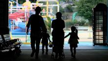 Parents and children enter a swimming pool open to a limited number of visitors as a preventive measure against coronavirus at Tokyo's Toshimaen amusement park on July 13.