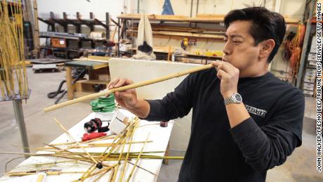Grant Imahara tests his bamboo blowpipe in preparation for the upcoming ninja myth segment for the cable television show &quot;Mythbuster&quot; in San Francisco, California, February 29, 2008.  (Photo by John Walker/Fresno Bee/Tribune News Service/Getty Images)