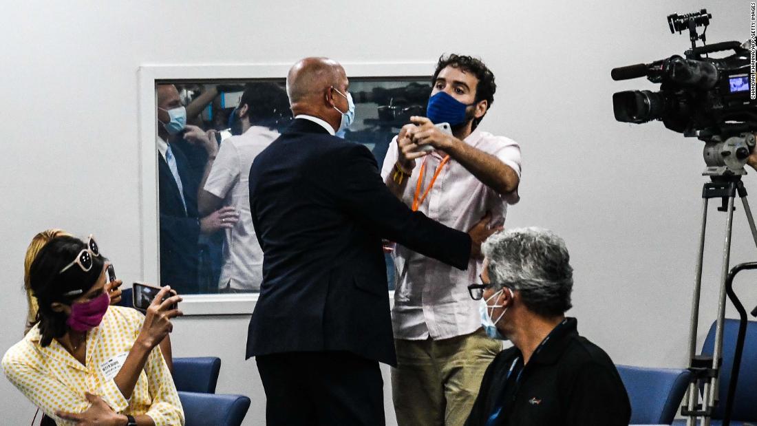 Activist Thomas Kennedy is escorted away by security as he &lt;a href=&quot;http://edition.cnn.com/videos/politics/2020/07/14/desantis-heckler-coronavirus-press-conference-flores-sot-newday-vpx.cnn&quot; target=&quot;_blank&quot;&gt;heckles Florida Gov. Ron DeSantis&lt;/a&gt; during a briefing in Miami on July 13. &lt;a href=&quot;http://www.cnn.com/2020/07/13/health/florida-coronavirus-cases-comparisons/index.html&quot; target=&quot;_blank&quot;&gt;If Florida were a country,&lt;/a&gt; it would have ranked No. 9 in the number of Covid-19 cases worldwide, according to Johns Hopkins data that day.