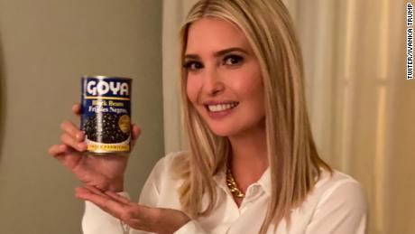 Trump holding a can of Goya black beans.