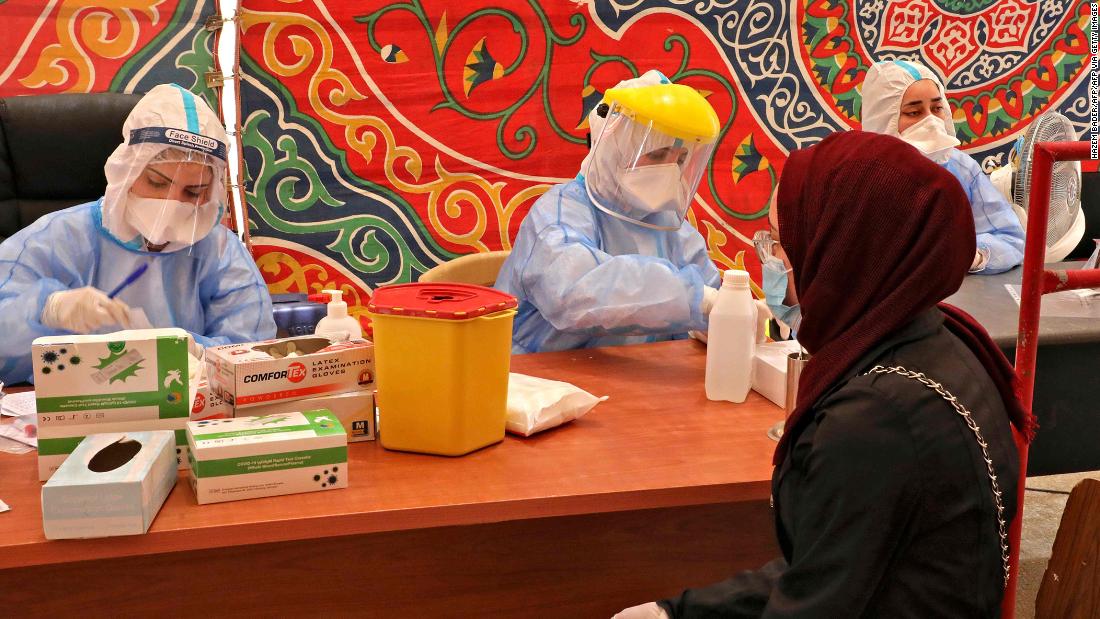 Doctors from the Palestinian Ministry of Health take blood samples in Hebron, West Bank, on July 15.