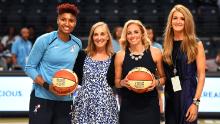 Angel McCoughtry #35 (left) of the Atlanta Dream is recognized for reaching 5,000 career points with Head Coach Nicki Collen and Atlanta Dream co-owners Mary Brock and Kelly Loeffler (far right)before the game against the Minnesota Lynx on May 29, 2018 at McCamish Pavilion in Atlanta. 