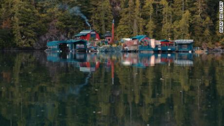 The floating compound houses a dance floor, an art gallery, a candle factory, four greenhouses, six solar panels, and a small waterfall that provides constant running water. 