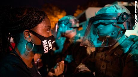 A demonstrator calls out to a military line near the White House on June 3 to protest the death of George Floyd. (AP Photo/Carolyn Kaster)