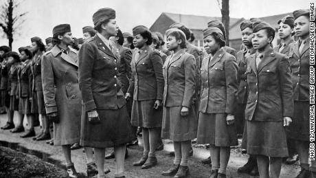 A US Major of Women&#39;s Army Corps inspects newly-arrived Black WACs troops at a temporary post in England, February 1945. (Photo by 12/UIG/Getty Images)