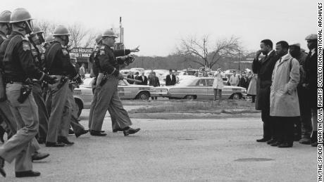 John Lewis, at right, then 25, is one of the marchers in confrontation with Selma, Ala., police on &quot;Bloody Sunday,&quot; March 7, 1965.