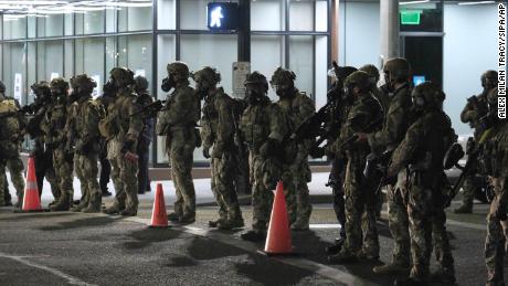 Federal officers standoff with protesters after clearing the streets with tear gas and other crowd control munitions as protests continue outside the federal courthouse in Portland on July 18.