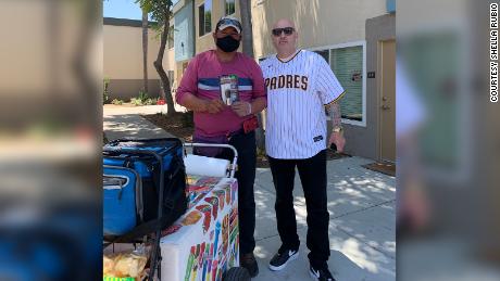 Marcos Navarro (right) says he delivered the first pepper spray kit to Ramon, a street vendor in Chula Vista, California.