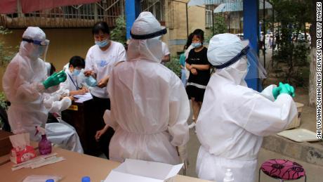 Residents undergo testing for the coronavirus on July 19 in Urumqi, China.