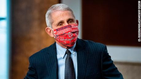 Anthony Fauci, director of the National Institute of Allergy and Infectious Diseases, wears a Washington Nationals face covering as he arrives during a Senate Health, Education, Labor and Pensions Committee hearing in Washington, DC, on June 30, 2020. - Fauci and other government health officials updated the Senate on how to safely get back to school and the workplace during the COVID-19 pandemic. (Photo by Al Drago / various sources / AFP) (Photo by AL DRAGO/AFP via Getty Images)