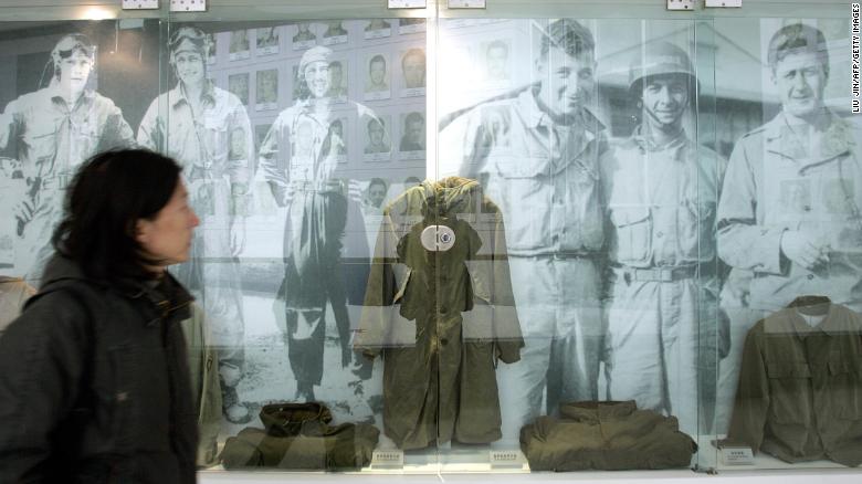 A visitor walks past images and old uniforms of the Flying Tigers at the Anti-Japanese War Museum in Dayi county in China&#39;s Sichuan province in 2005.