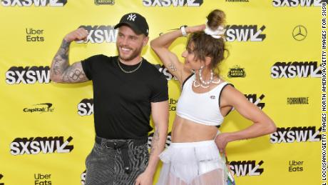 Alexi Pappas and Gus Kenworthy dispay their Olympic ring tattoos during the premiere of &quot;Olympic Dreams&quot; at the SXSW festival in Austin, Texas.