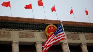 BEIJING, CHINA - NOVEMBER 9:  The U.S. flag and Chinese flags fly at a welcoming ceremony between Chinese President Xi Jinping and U.S. President Donald Trump November 9, 2017 in Beijing, China. Trump is on a 10-day trip to Asia.  (Photo by Thomas Peter-Pool/Getty Images)