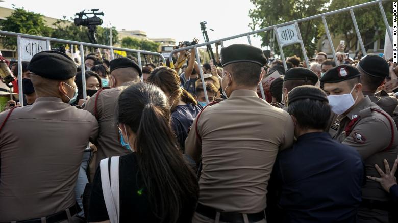 Police attempt to hold back protesters from entering the Democracy Monument to hold an anti-government demonstration in Bangkok on July 18.