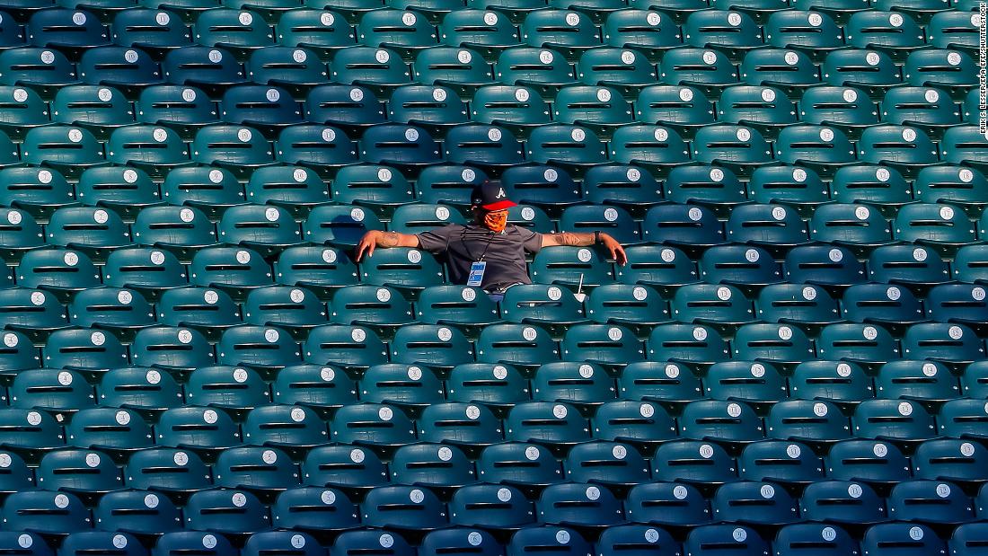 A stadium worker watches an Atlanta Braves scrimmage on July 13.