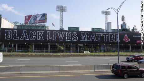 The phrase &quot;Black Lives Matter&quot; -- written in the Red Sox team&#39;s font -- has been placed on the massive billboard that runs alongside the Massachusetts Turnpike by Fenway Park. 