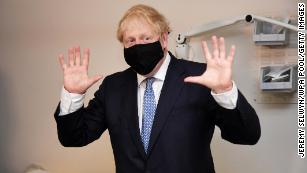 Masks rule goes into effect in England as Boris Johnson calls anti-vaxxers 'nuts'