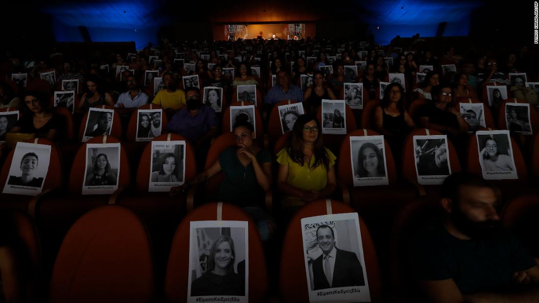 Portraits are taped onto seats to help theatergoers spread out in Nicosia, Cyprus, on July 27.