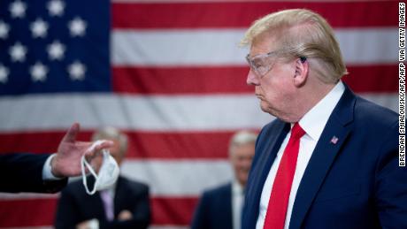 TOPSHOT - US President Donald Trump tours a Honeywell International Inc. factory producing N95 masks during his first trip since widespread COVID-19 related lockdowns went into effect May 5, 2020, in Phoenix, Arizona. (Photo by Brendan Smialowski / AFP) (Photo by BRENDAN SMIALOWSKI/AFP via Getty Images)