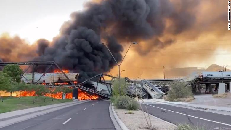 Plumes of smoke rise above fiery scene of train derailment Wednesday.