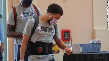 Tyus Jones #21 of the Memphis Grizzlies arrives during practice as part of the NBA restart 2020 on July 17, 2020 in Orlando, Florida.