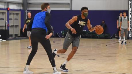 Giannis Antetokounmpo #34 of the Milwaukee Bucks dribbles the ball during practice as part of the NBA restart 2020 on July 27, 2020 in Orlando, Florida.