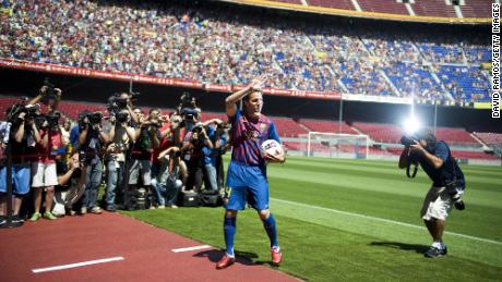 Fabregas gestures during his presentation as the new signing for FC Barcelona at Camp Nou sports complex on August 15, 2011 in Barcelona, Spain.
