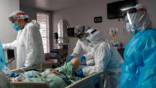 HOUSTON, TX - JULY 28:  (EDITORIAL USE ONLY) Members of the medical staff treat a patient in the COVID-19 intensive care unit at the United Memorial Medical Center on July 28, 2020 in Houston, Texas. COVID-19 cases and hospitalizations have spiked since Texas reopened, pushing intensive-care units to full capacity and sparking concerns about a surge in fatalities as the virus spreads.  (Photo by Go Nakamura/Getty Images)