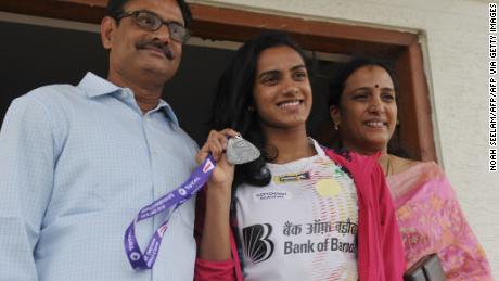 &#39;Your rock and pillars&#39;: Sindhu with her father Ramana (L) and mother Vijaya (R) who have played a central role in her upward trajectory