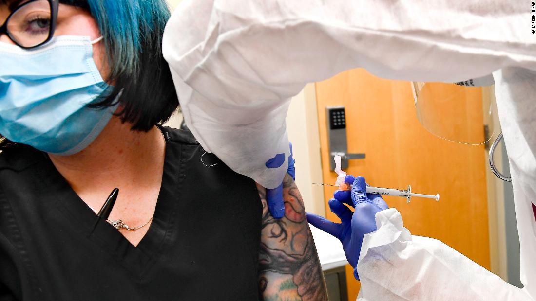 Nurse Kathe Olmstead gives an injection to volunteer Melissa Harting in Binghamton, New York, on July 27. It was part of a clinical trial for a coronavirus vaccine. &lt;a href=&quot;https://www.cnn.com/2020/07/27/health/coronavirus-vaccine-trial-begins-moderna-phase-3/index.html&quot; target=&quot;_blank&quot;&gt;The trial&lt;/a&gt; is the first to reach Phase 3 in the United States. 