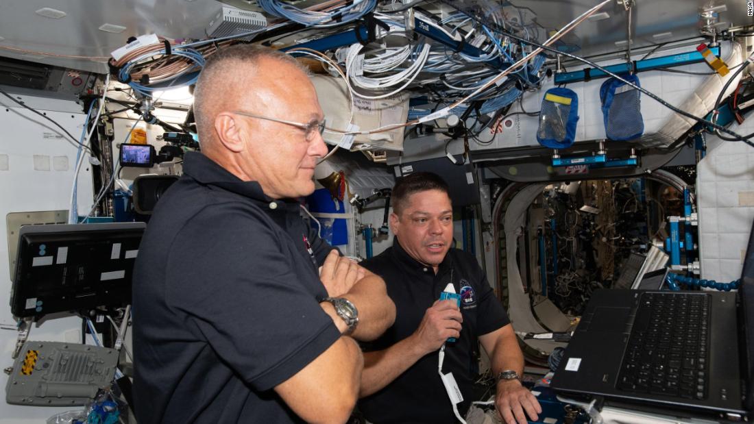 Hurley, left, and Behnken brief mission control on June 1.