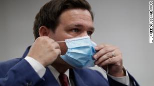 &#39;We&#39;re dying here,&#39; Florida newspaper says in pleading with governor to issue a statewide mask mandate