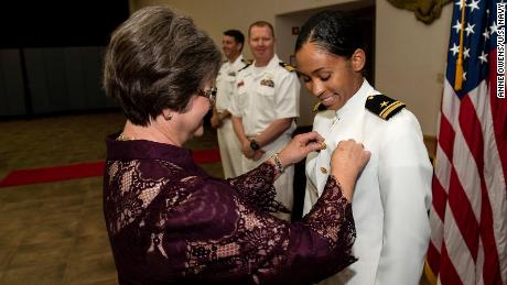 Lt. j.g. Madeline Swegle receives her gold naval aviator wings in a ceremony at Naval Air Station Kingsville in Texas.