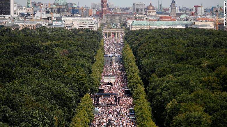 Thousands attend a protest against coronavirus restrictions at the Brandenburg Gate in Berlin on Saturday, August 1.