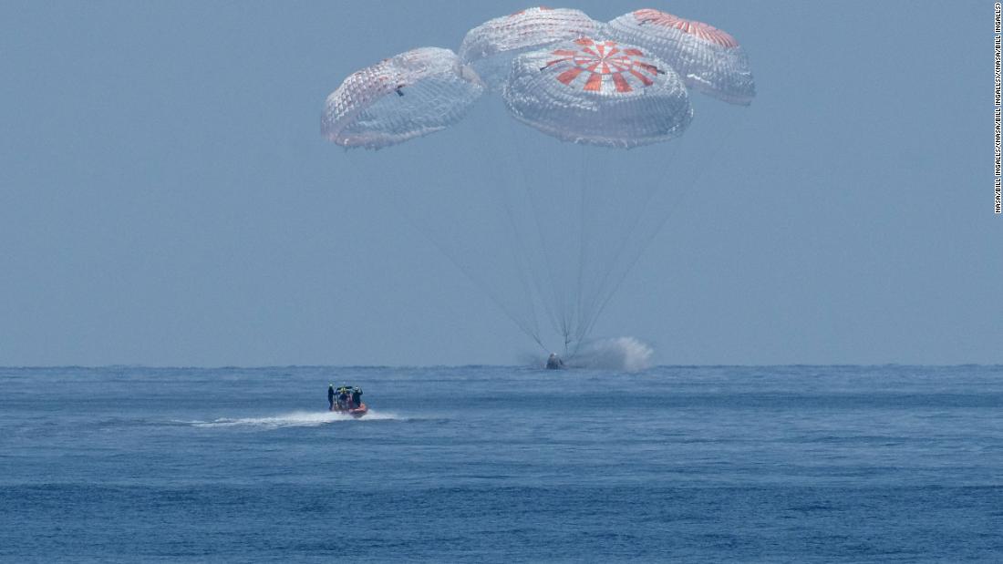 SpaceX&#39;s Crew Dragon spacecraft, carrying NASA astronauts Robert Behnken and Douglas Hurley, splashes down into the Gulf of Mexico on Sunday, August 2.