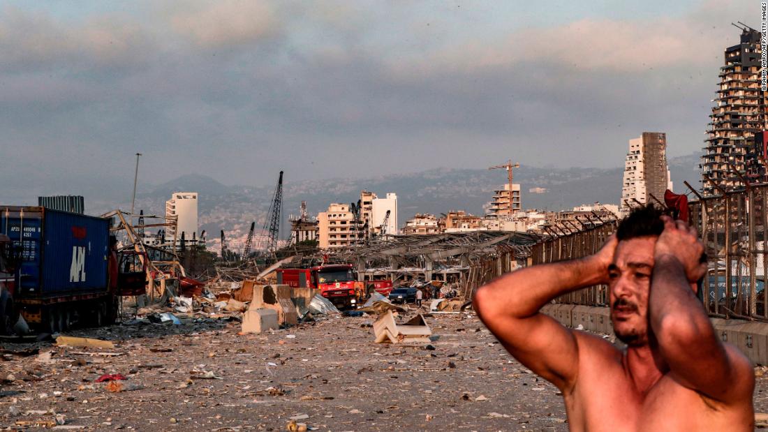 A man reacts at the scene soon after the blast.