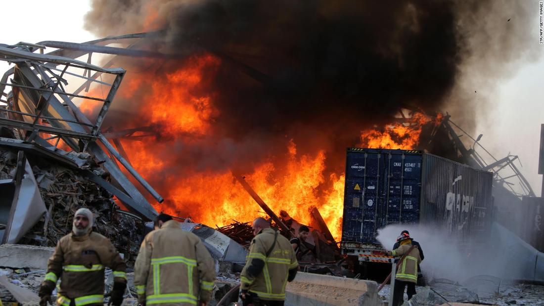 Firefighters work at the scene after the explosion.