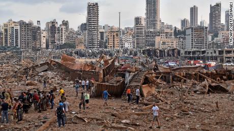 EDITORS NOTE: Graphic content / A picture shows the scene of an explosion near the the port in the Lebanese capital Beirut on August 4, 2020. - Two huge explosion rocked the Lebanese capital Beirut, wounding dozens of people, shaking buildings and sending huge plumes of smoke billowing into the sky. Lebanese media carried images of people trapped under rubble, some bloodied, after the massive explosions, the cause of which was not immediately known. (Photo by STR / AFP) (Photo by STR/AFP via Getty Images)