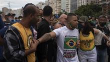 Supporters of Brazilian President Jair Messias Bolsonaro gather in support of him and to protest against racism and the death of blacks in the slums of Brazil during a Black Lives Matter protest on Copacabana beach in Rio de Janeiro on June 7, 2020.