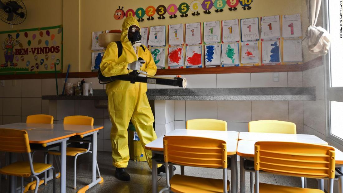 A worker disinfects a public school in Brasilia, Brazil, on August 5. The local government has begun preparations for the reopening of schools in early September.