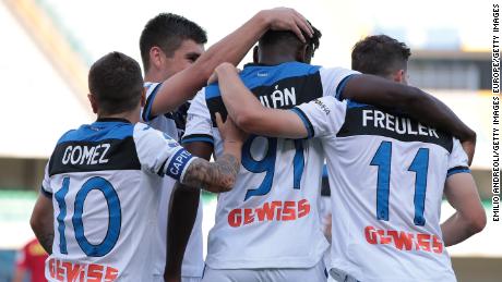 Zapata celebrates with his team-mates after scoring the opening goal against Hellas Verona.