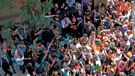 French President Emmanuel Macron speaks to the crowd during a visit to the Gemmayzeh neighbourhood, which has suffered extensive damage due to a massive explosion in the Lebanese capital, on August 6, 2020. - French President Emmanuel Macron visited shell-shocked Beirut, pledging support and urging change after a massive explosion devastated the Lebanese capital in a disaster that has sparked grief and fury. (Photo by ANWAR AMRO / AFP) (Photo by ANWAR AMRO/AFP via Getty Images)