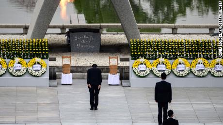 Abe bows in front of the Memorial Cenotaph at the Peace Memorial Park in Hiroshima on August 6, 2020. 