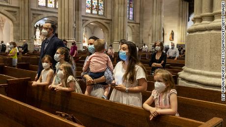 A family prays during mass at St. Patrick&#39;s Cathedral in New York City on June 28.