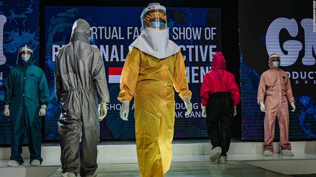 Medical workers in Yogyakarta, Indonesia, showcase designs during a fashion show of personal protective equipment on August 1. The fashion show was held as a form of gratitude for all medical personnel who have been fighting Covid-19.