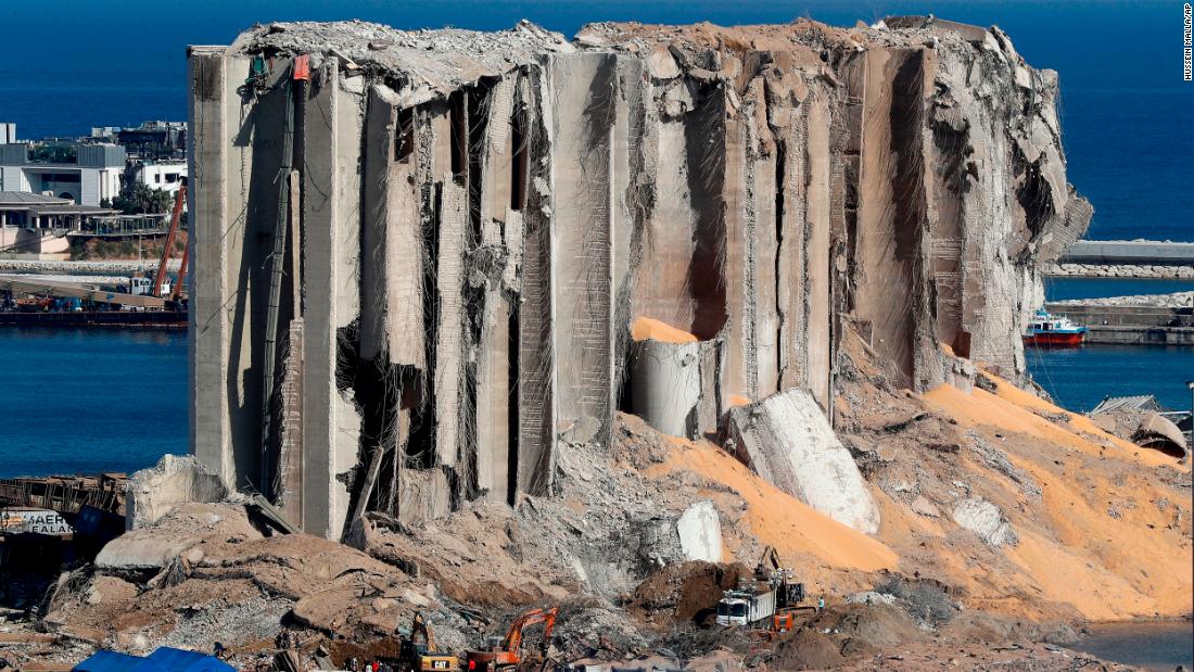 Rescue workers search for missing people at the site of the explosion.